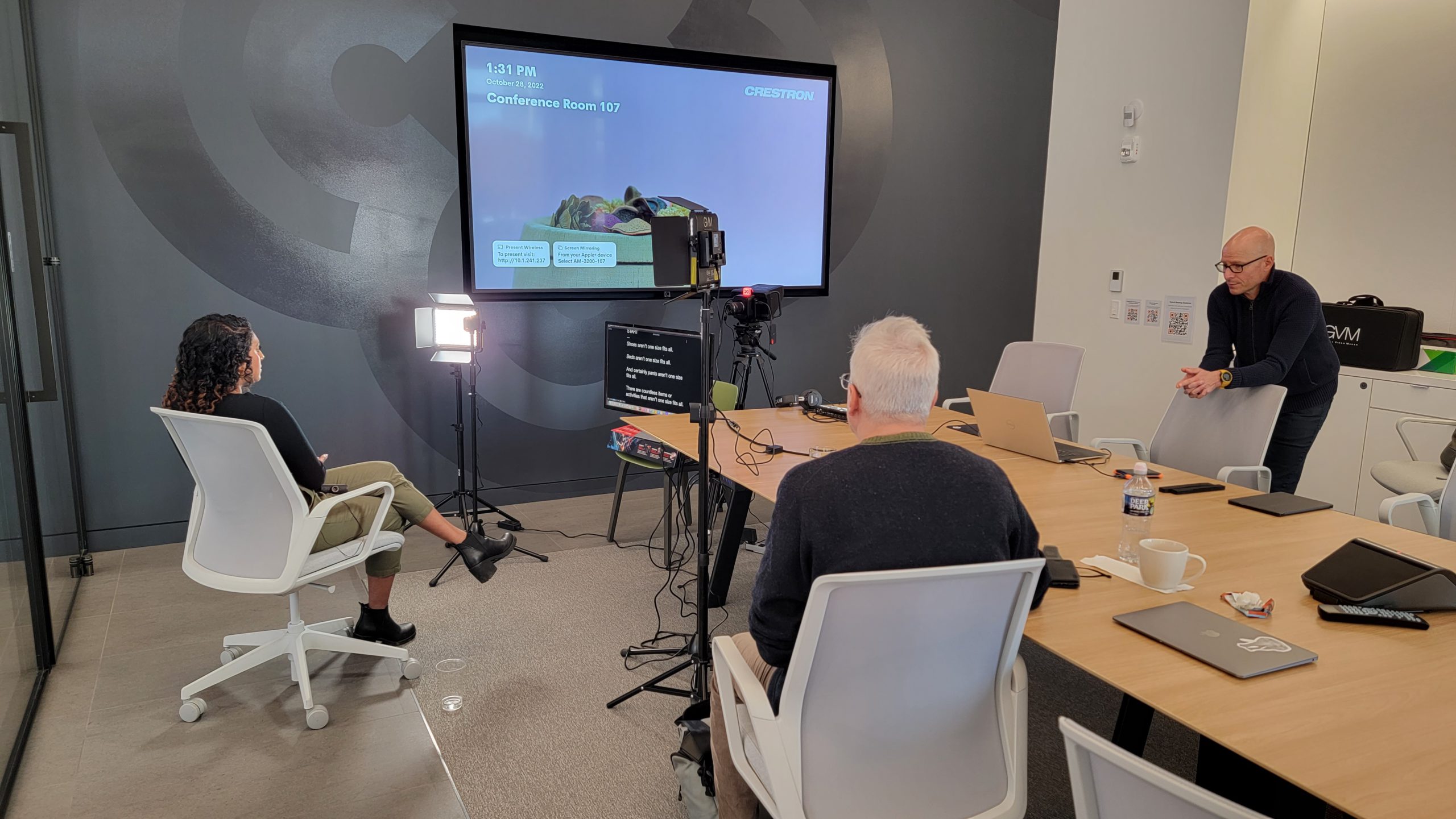 A filmed conversation being prepared by the production team